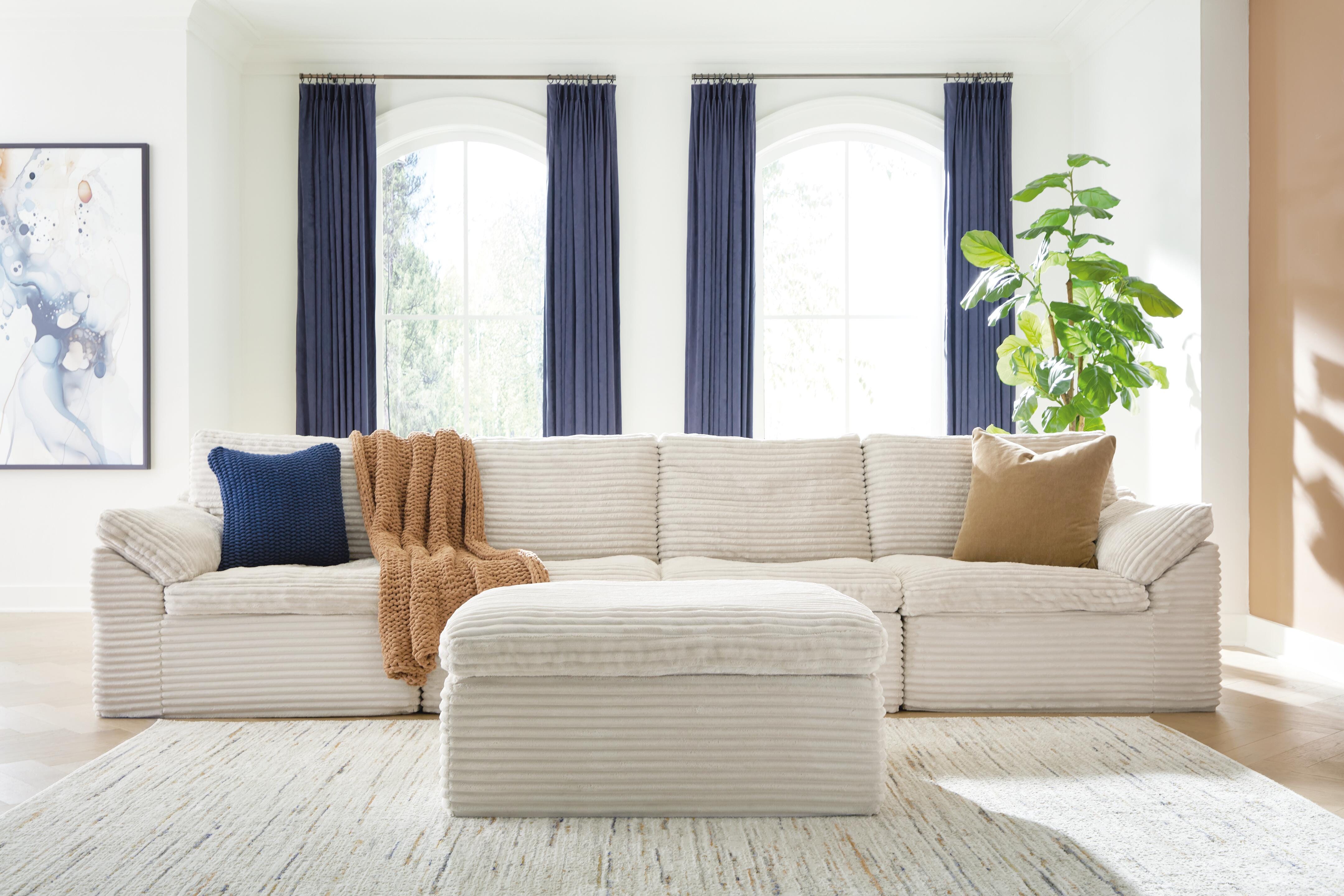Dar Furniture - Ashley Furniture - Fannin 4-Piece Sectional with Ottoman - RAF 4-Piece Sectional with Ottoman / Ivory - PC84304S1