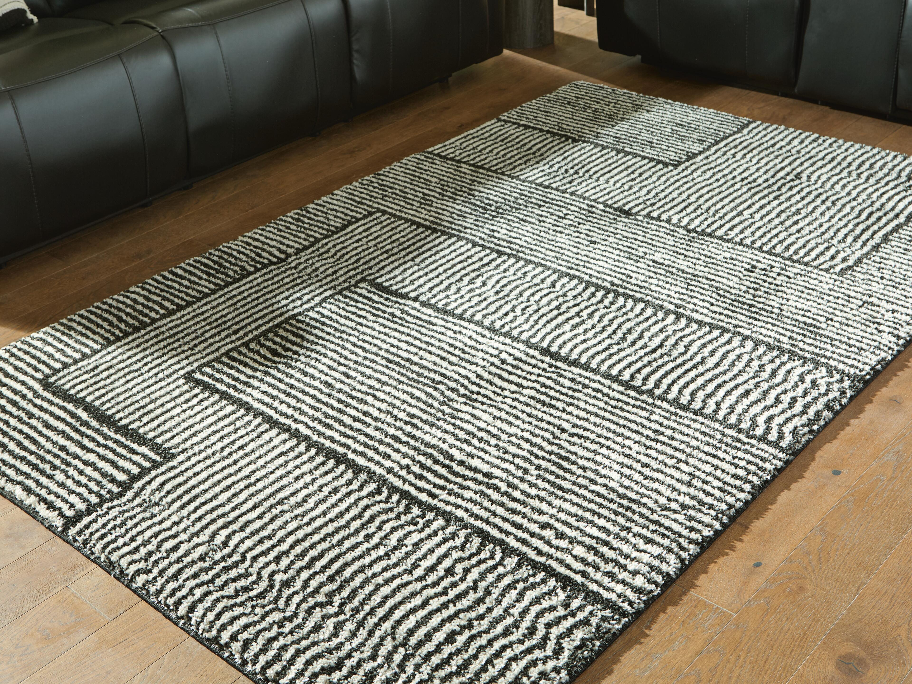 Dar Furniture - Ashley Furniture - Kurtmen 5' x 7' Area Rug - 5' x 7' Area Rug / Black/Ivory - R407592