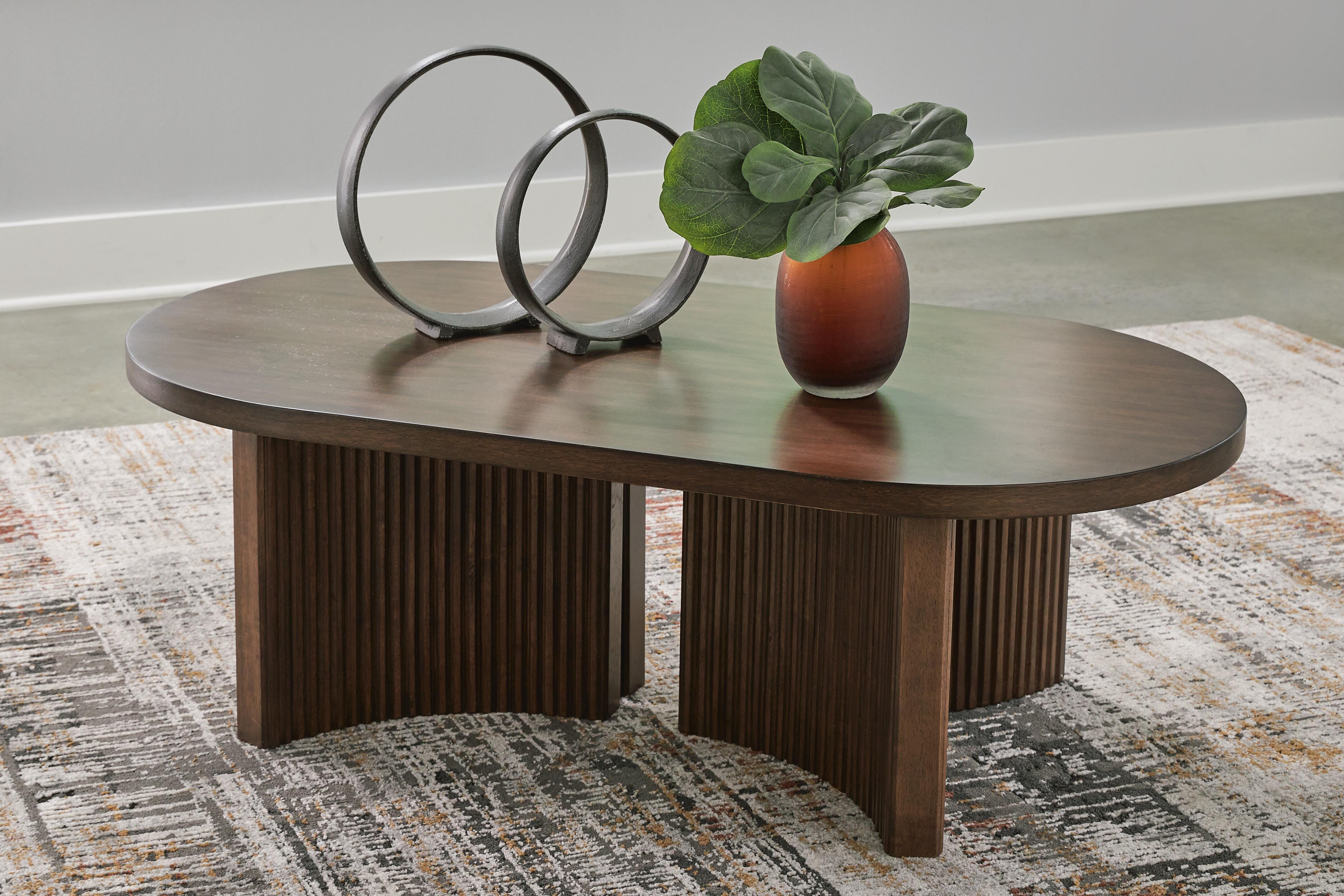 Dar Furniture - Ashley Furniture - Korestone Coffee Table - Oval Cocktail Table / Dark Brown - T689-0